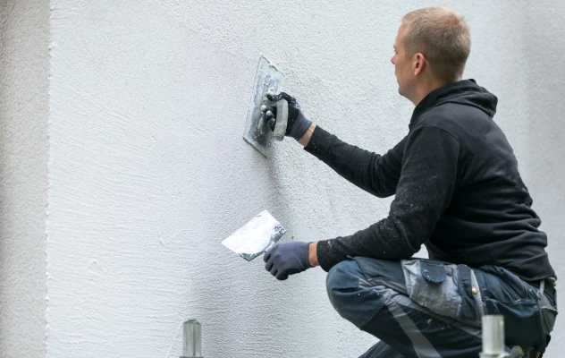 What is the difference between plastering and rendering scaled